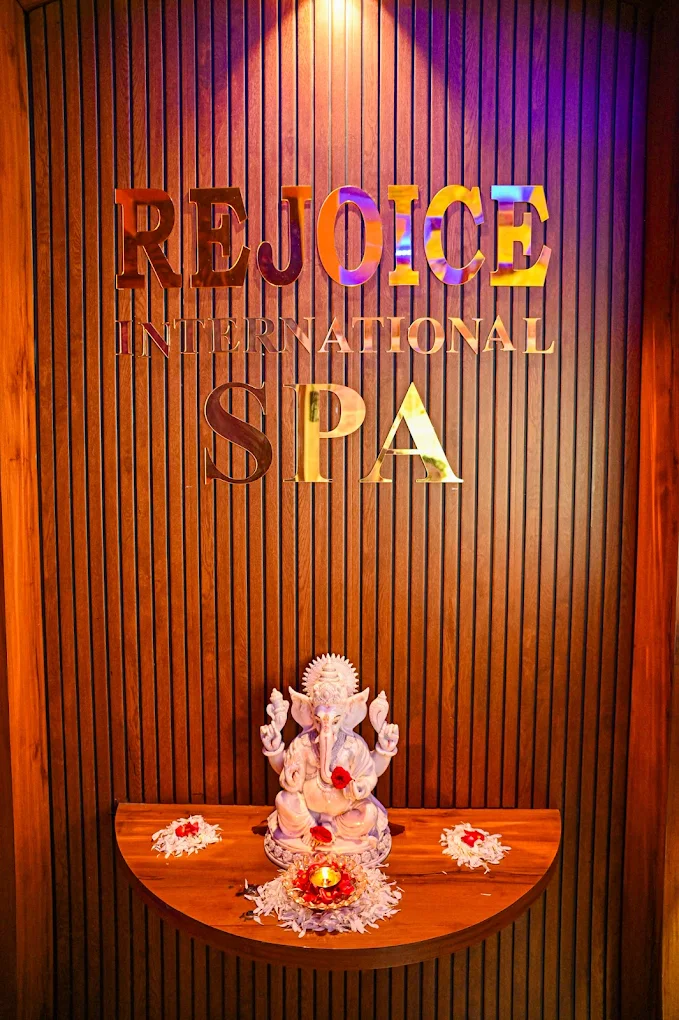 Rejoice International Spa brand wall and reception detail in Bellandur