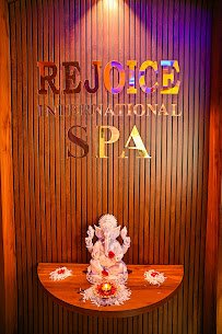 Rejoice International Spa logo wall interior detail