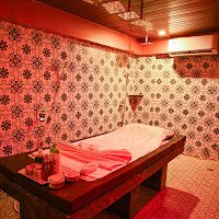 Warm therapy room interior at Rejoice International Spa