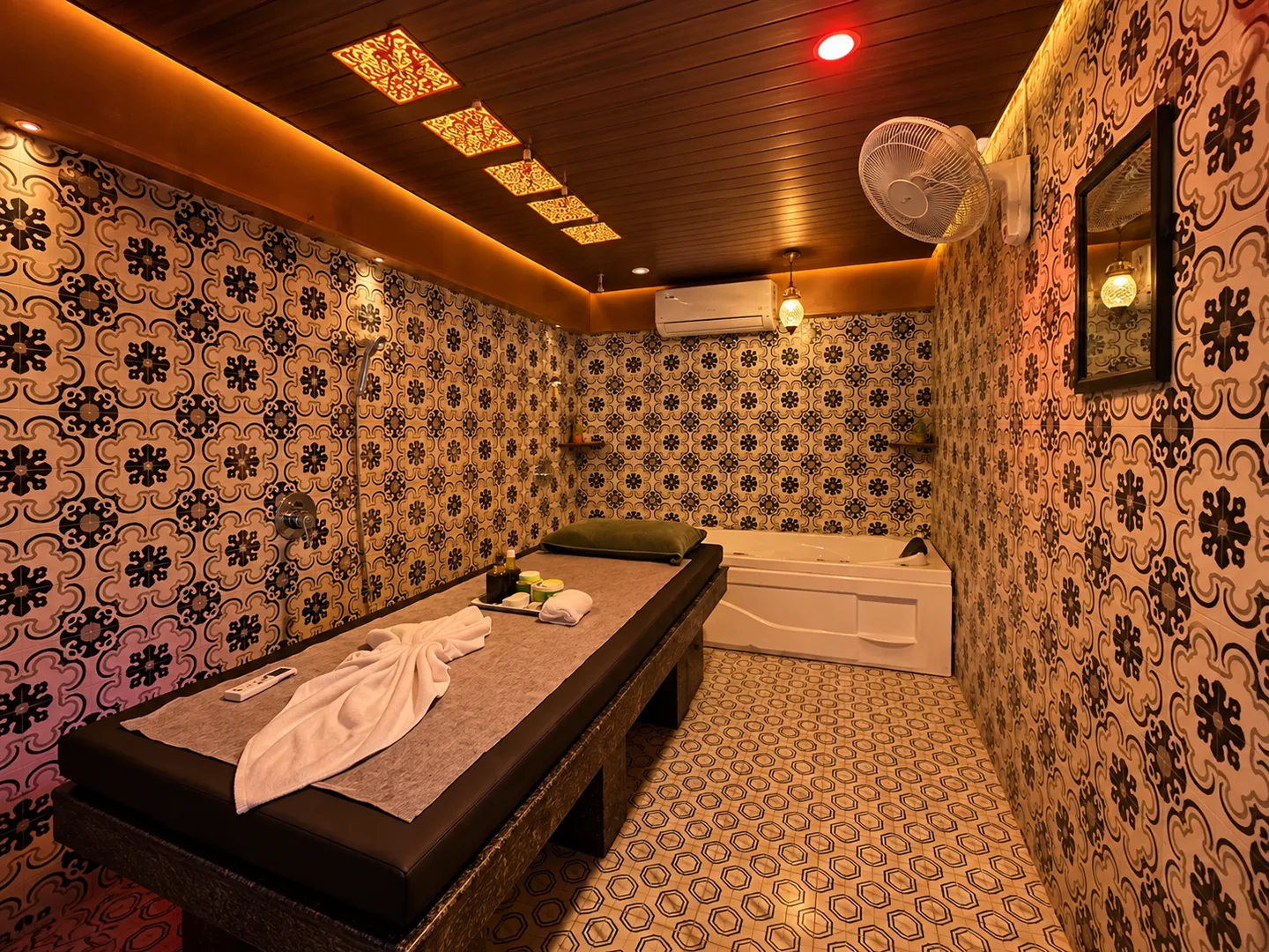Private spa suite with treatment bed and jacuzzi