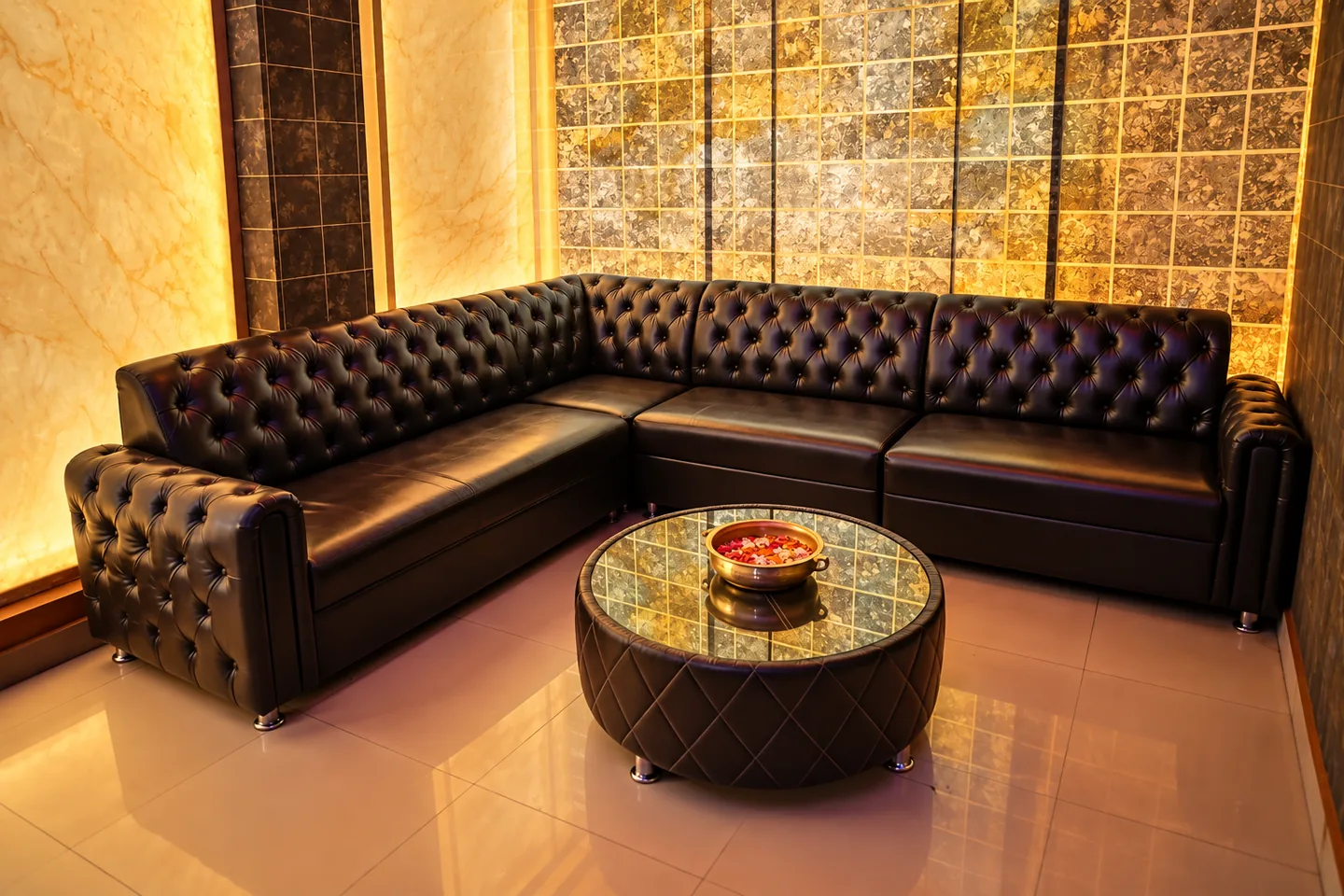 Waiting lounge with leather seating and floral welcome bowl
